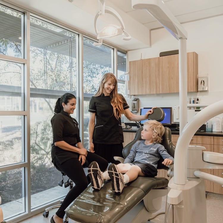 General Dentist Sunshine Coast - dentists and child in room