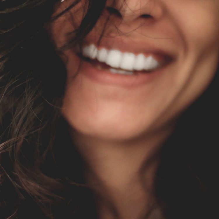 dental implants - closeup of smiling woman